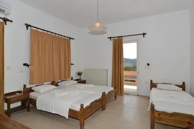 a bedroom with two beds and a window at Niriida in Sfinárion