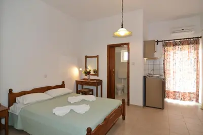 a bedroom with a bed with towels on it at Niriida in Sfinárion