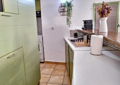 a kitchen with a sink and a counter top at Icarus Loft Old Town rooftop terrace in Chania Town