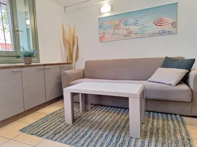 a living room with a couch and a table at Icarus Loft Old Town rooftop terrace in Chania Town