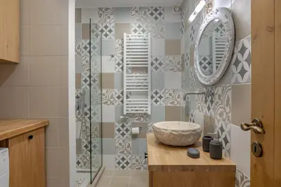a bathroom with a sink and a mirror at Alexandras's Mansion in Ayiá