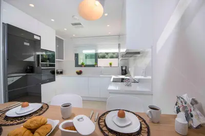 a kitchen with a table with plates of food on it at Kalyves Royal Villa I 