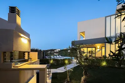 a house with a view of a yard at Kalyves Royal Villa I 