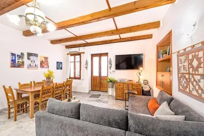 a living room with a couch and a table at Yiayia's Place in Chania in Chania Town