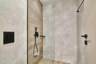 a shower with a glass door in a bathroom at Thearia villa I - seaview , private heated pool & jacuzzi in Souda