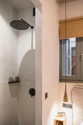 a kitchen with a pendant light hanging from the wall at Casa Athanasia in Chania Town