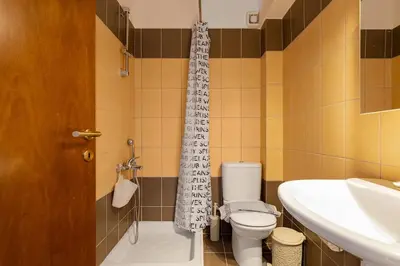 a bathroom with a toilet and a sink at Apartment Lia with private eco pool - Amazing view in Chania Town