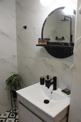 a bathroom with a sink and a mirror at Aryiro's Residence,Cozy&Sunny in Alikianós