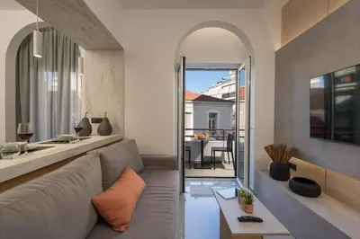 a living room with a couch and a table at Amara Local Experience in Chania Town