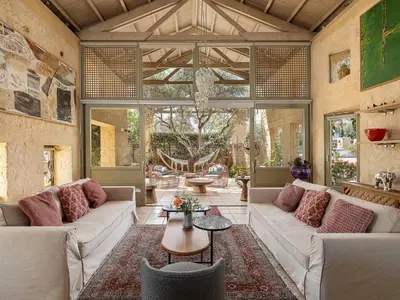 a large living room with couches and a table at Villa Dimi in Kalathas
