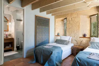 a bedroom with two beds in a room at Villa Dimi in Kalathas