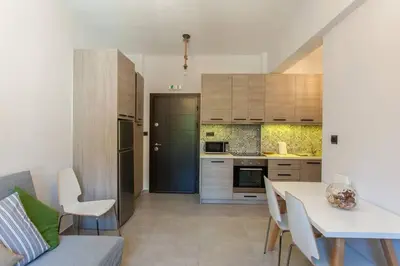 a kitchen and dining room with a table and chairs at ML in Chania Town
