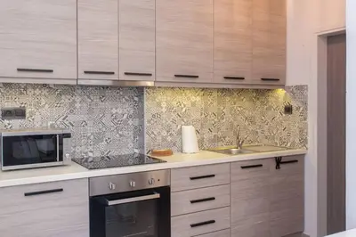 a kitchen with a sink and a microwave at ML in Chania Town