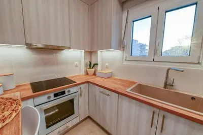 a kitchen with a sink and a stove at Magedico 150m from the beach in Kissamos