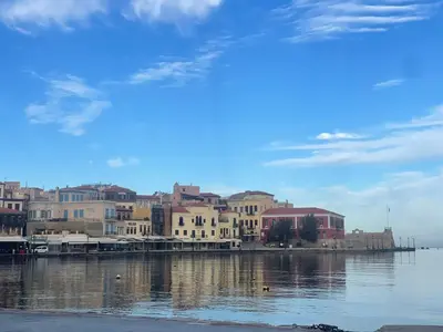 a group of buildings next to a body of water at AIOLOS Chania center luxury apartment near the garden in Chania Town