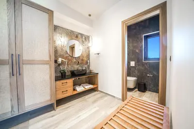 a bathroom with a sink and a mirror at In Vivo Villa - Breathtaking View -90sqm Heated Infinity Pool in Áyios Pávlos