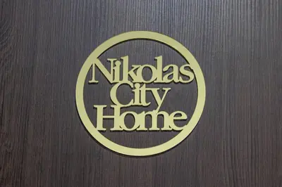 a wooden door with a nitzgas city line sign at Nikolas City Home in Chania Town