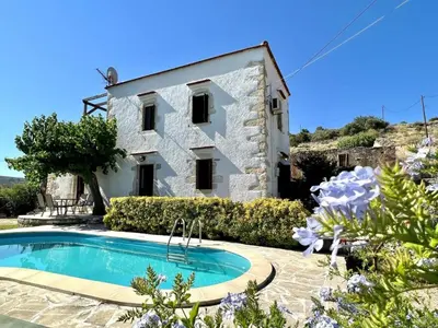 an external view of a house with a swimming pool at Villa Ovgoro, Provarma, pool, seaview balcony in Próvarma