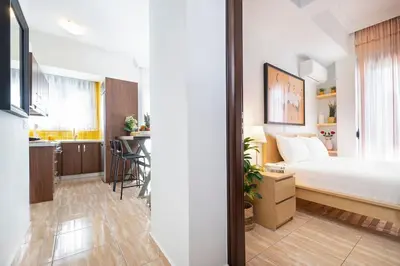a small apartment with a bed and a kitchen at Home Philip III in Chania Town