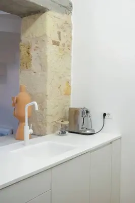 a kitchen counter with a toaster on top of it at Elorhouse in the charming neighborhood of KoumKapi in Chania Town