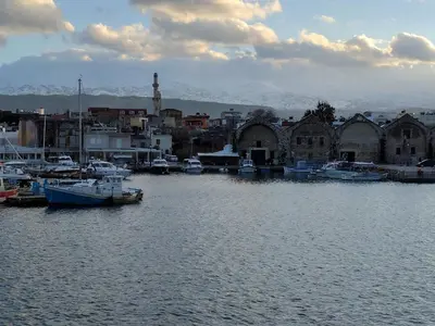 a group of boats docked in a harbor at Rayon De Soleil in Chania Town