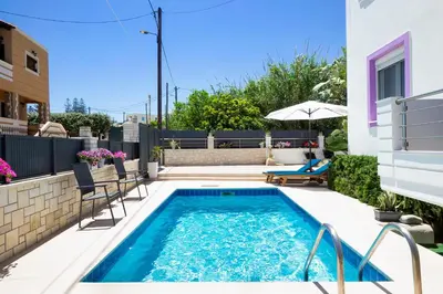 a swimming pool in a backyard with a house at Geas House Ammos in Kolymvari