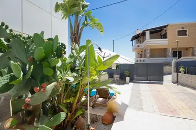 a view of a house with plants and a pool at Geas House Ammos in Kolymvari