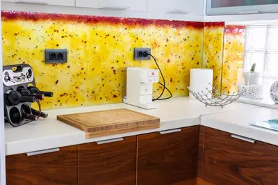 a kitchen with a white counter and a yellow wall at Seaty Luxury apartment in Chania Town