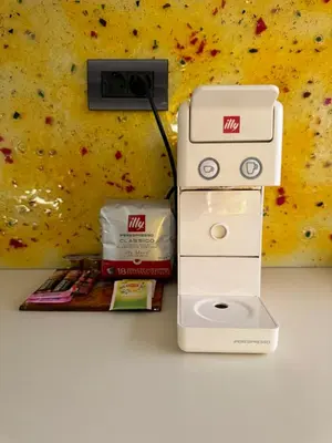 a nintendo wii game system next to a wall at Seaty Luxury apartment in Chania Town