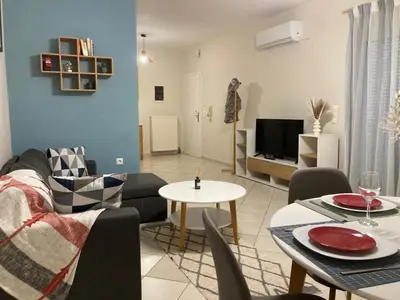 a living room with a couch and a table at Stephanie's Place - Charming Apartment with Sea View in Chania Town
