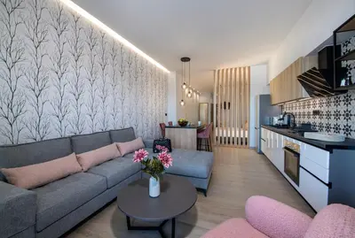 a living room with a couch and a table at ALPHA SUITES in Chania Town