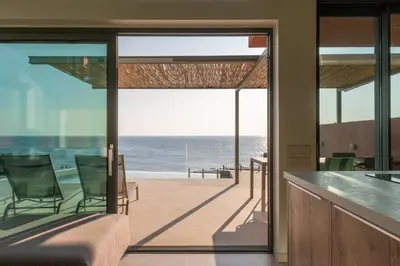 a house with a view of the ocean at Casa Tarrha- Beachfront Villa with Heated Pool in Livadia