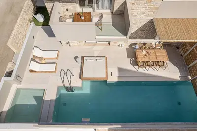 an overhead view of a swimming pool in a house at Pietra Di Sabbia Villas in Palaiochóra