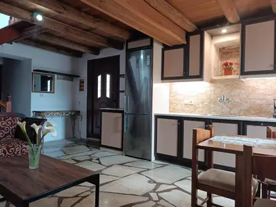 a kitchen and dining room with a table at Villa Lina private pool in Kondomari