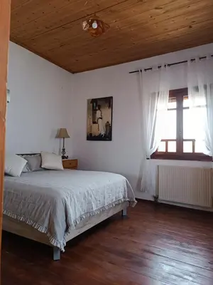 a bedroom with a bed and a wooden ceiling at Villa Lina private pool in Kondomari
