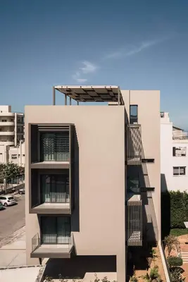 a white building with a staircase on the side of it at Chania Elegance Suites in Chania Town
