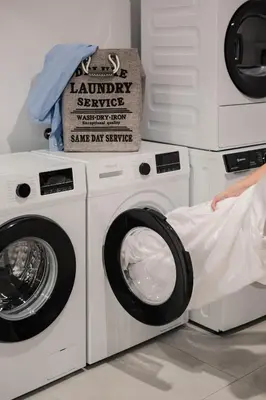 two washing machines and a washer and dryer at Chania Elegance Suites in Chania Town