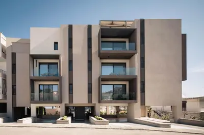a facade of a building with large windows at Chania Elegance Suites in Chania Town