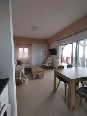 a living room with a couch and a table at Votsalo House in Khóra Sfakíon