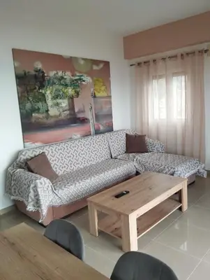 a living room with a couch and a coffee table at Votsalo House in Khóra Sfakíon