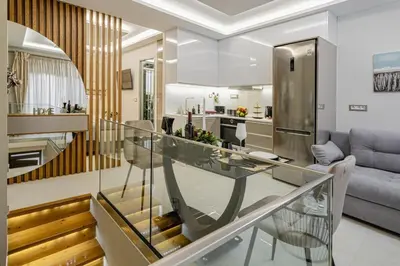 a dining room and living room with a glass table at Nicole Studio in Center Chania in Chania Town