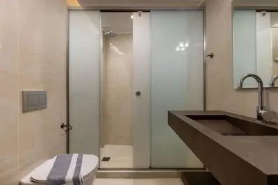 a bathroom with a shower and a toilet and a sink at The Owl House near Chania City Centre in Chania Town