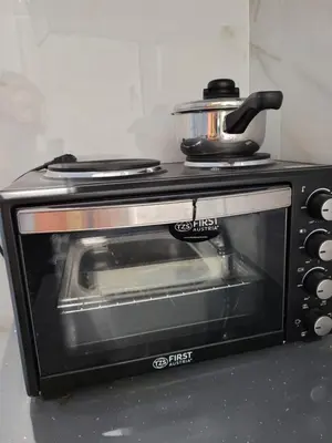 a toaster oven with a pot on top of it at Cretan Dream in Chania Town