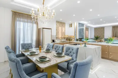 a dining room and kitchen with a table and chairs at Kallisti Palace - Private Pool with Hydromassage in Kissamos
