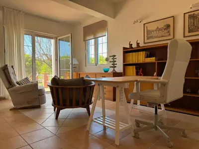 a living room with a table and two chairs at Primavera Retreat in Chania Town