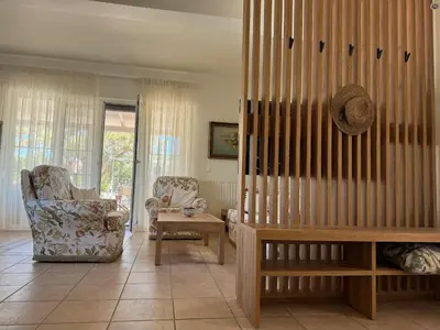 a living room with a couch and a chair at Primavera Retreat in Chania Town