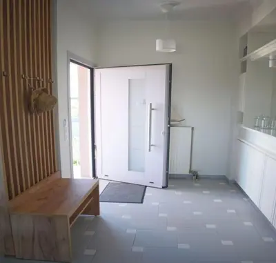 a room with a door open to a kitchen at Verano Retreat in Chania Town