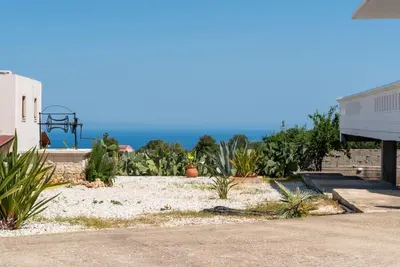 a view of a yard with plants and a building at Bella Vista Casa in Chania Town