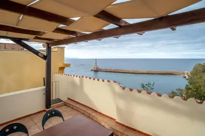 a balcony with a view of the ocean at In Heart of Old Town w. Venetian Port Views in Chania Town