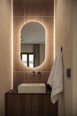 a bathroom with a sink and a mirror at Copal Simple Staying in Chania Town